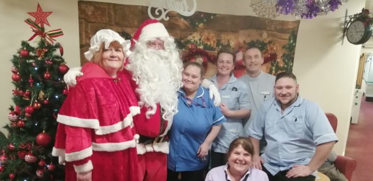  Santa Claus deliver early present to care home residents 